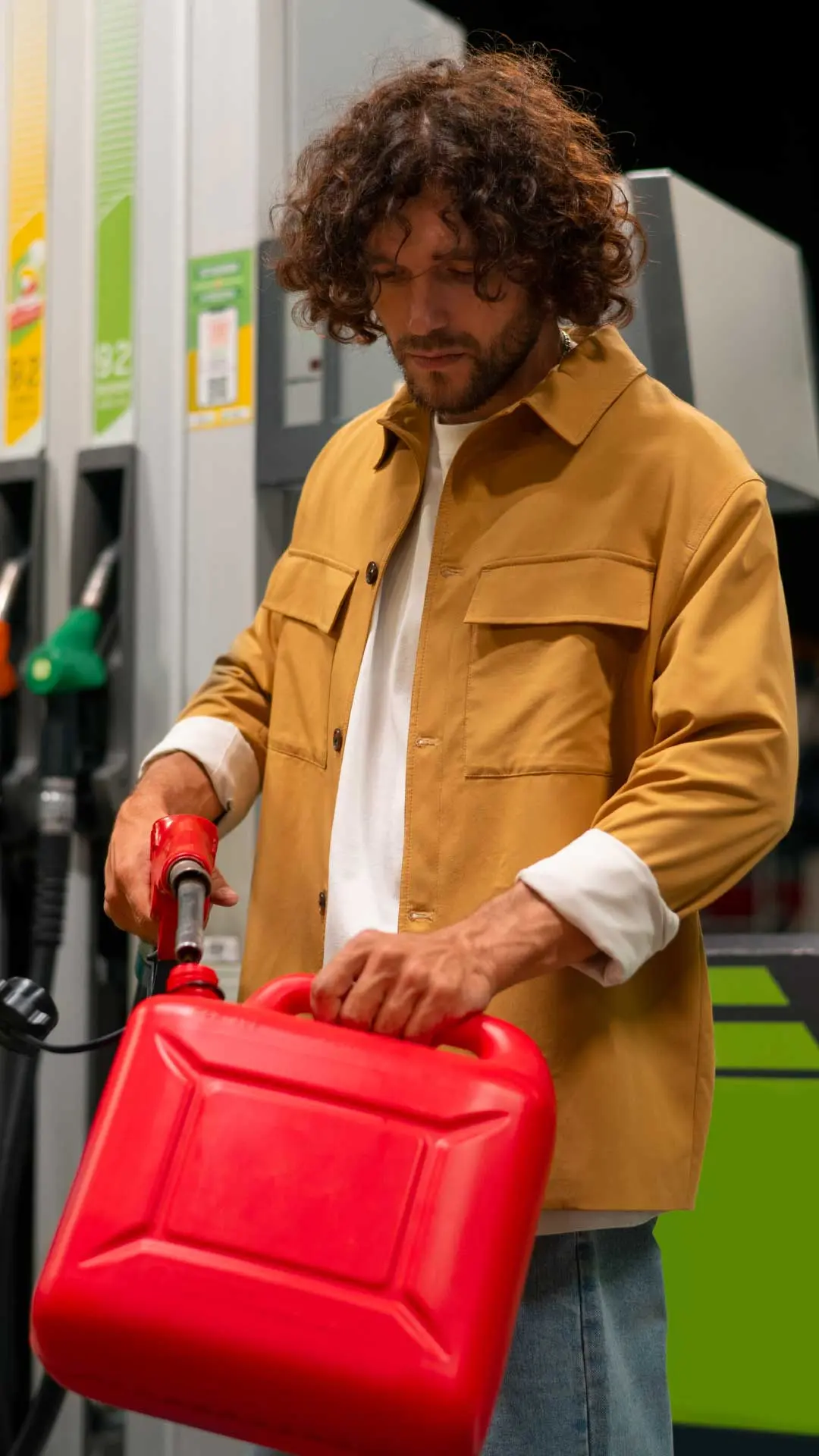 Man Pouring Fuel In Jar